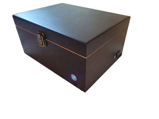 A closed soundproof enclosure box made of black wood with a white noise generator built-in, featuring a USB connection and an LED status indicator.